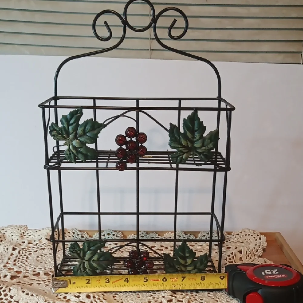 Source Unknown Black and Green Display Shelves with Nature-Inspired Design
